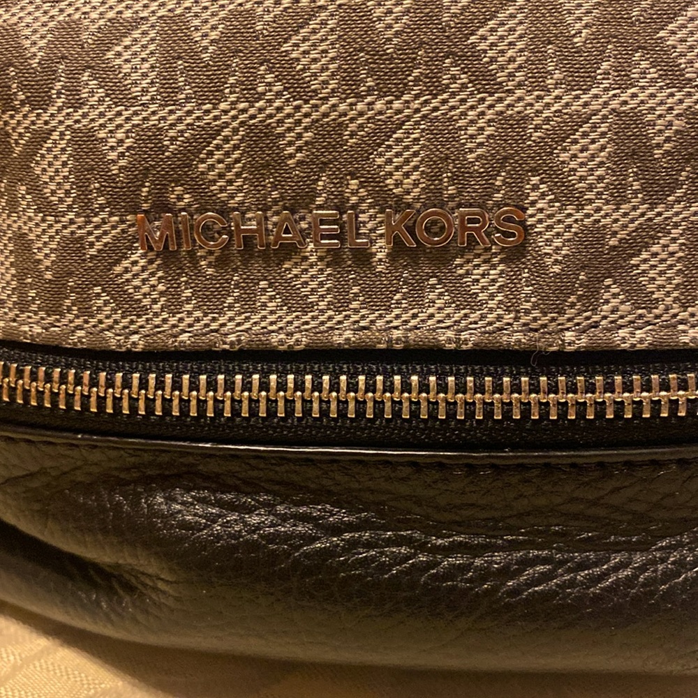 MICHAEL KORS BACKPACK tan color with black. Used